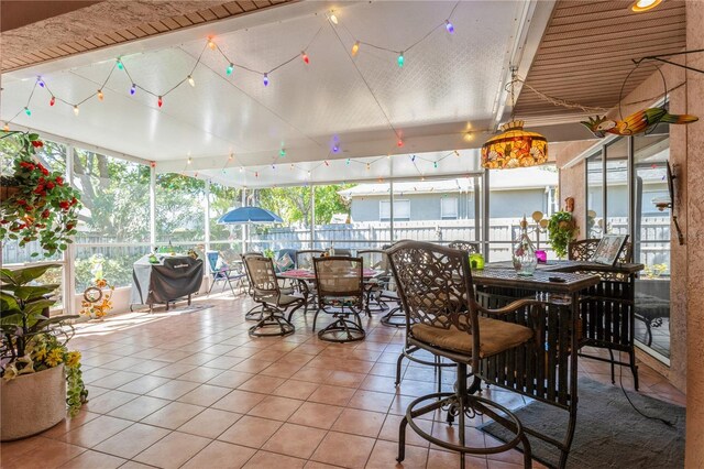 3627 Cypress Meadows Rd, Tampa, FL 33624 - sunroom / solarium featuring outdoor dining space