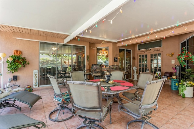 3627 Cypress Meadows Rd, Tampa, FL 33624 - view of patio / terrace featuring outdoor dining area and french doors