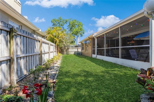 3627 Cypress Meadows Rd, Tampa, FL 33624 - view of yard with a fenced backyard and a sunroom