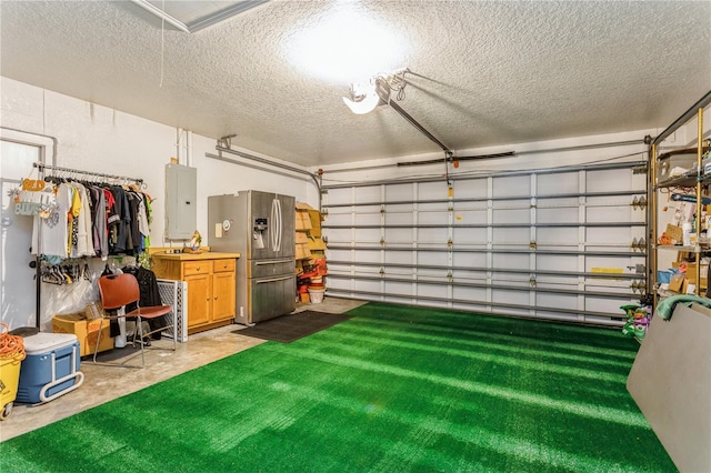 3627 Cypress Meadows Rd, Tampa, FL 33624 - garage with stainless steel fridge and electric panel
