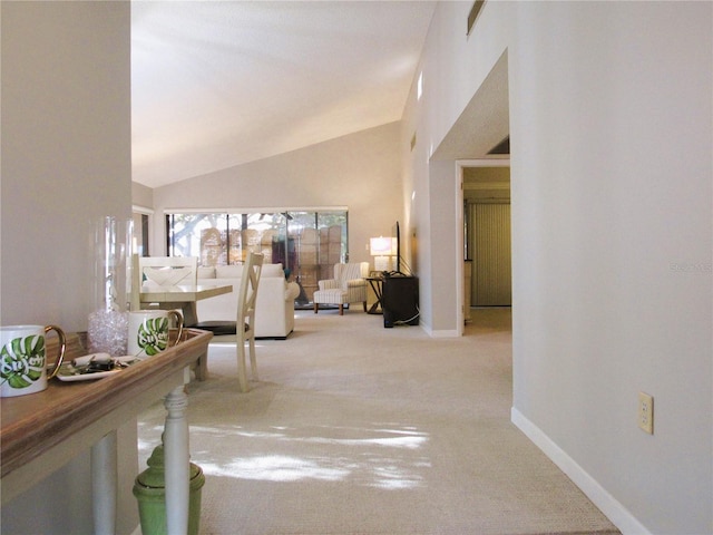700 Starkey Rd Unit 821, Largo, FL 33771 - corridor featuring lofted ceiling, carpet flooring, and baseboards