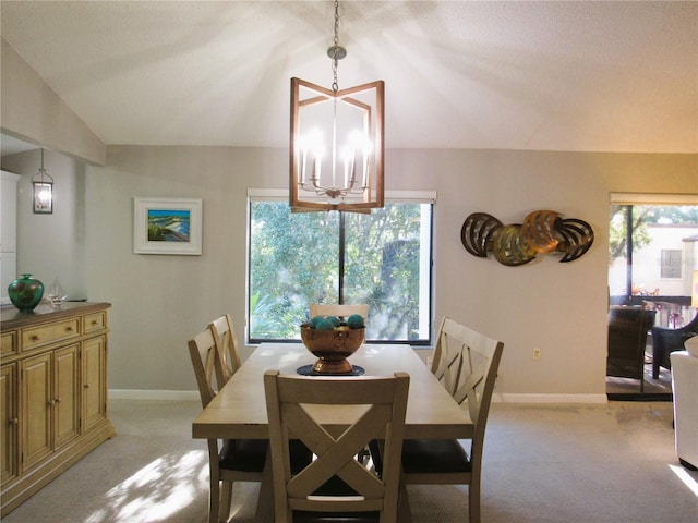 700 Starkey Rd Unit 821, Largo, FL 33771 - dining space with light carpet, a notable chandelier, baseboards, and lofted ceiling