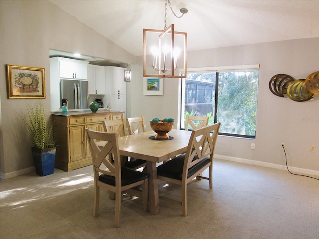 700 Starkey Rd Unit 821, Largo, FL 33771 - dining space with a chandelier, light colored carpet, baseboards, and lofted ceiling