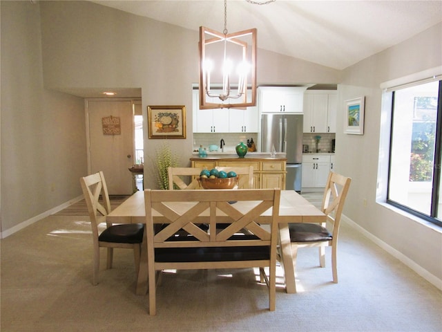 700 Starkey Rd Unit 821, Largo, FL 33771 - dining area with baseboards, lofted ceiling, light colored carpet, and a chandelier