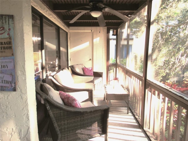 700 Starkey Rd Unit 821, Largo, FL 33771 - sunroom with beamed ceiling and a ceiling fan