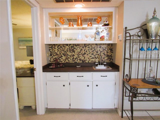 700 Starkey Rd Unit 821, Largo, FL 33771 - bar with wet bar, light carpet, tasteful backsplash, and a sink