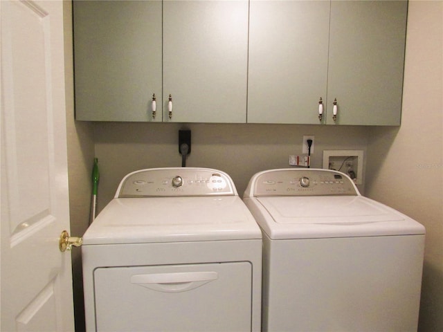 700 Starkey Rd Unit 821, Largo, FL 33771 - washroom featuring cabinet space and washer and clothes dryer