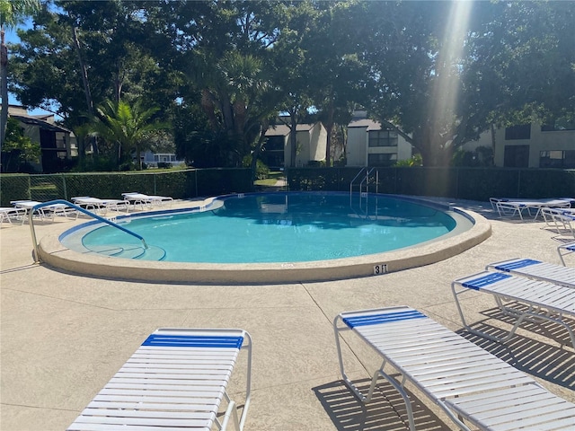 700 Starkey Rd Unit 821, Largo, FL 33771 - community pool featuring a patio area and fence