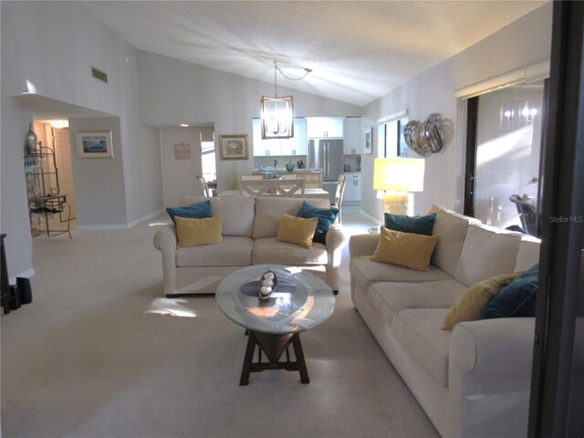 700 Starkey Rd Unit 821, Largo, FL 33771 - living area featuring lofted ceiling, baseboards, visible vents, and light carpet