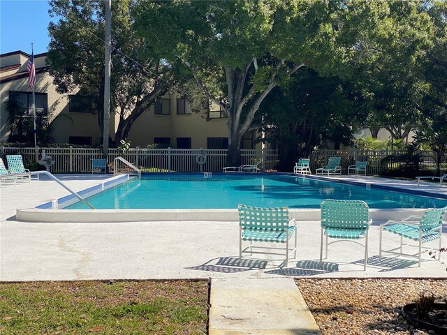700 Starkey Rd Unit 821, Largo, FL 33771 - community pool with a patio area and fence