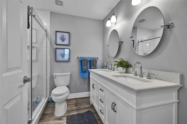 812 Gulf # 3, Indian Rocks Beach, FL 33785 - bathroom featuring visible vents, a sink, toilet, and wood finished floors