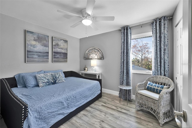 812 Gulf # 3, Indian Rocks Beach, FL 33785 - bedroom featuring baseboards, wood finished floors, and ceiling fan