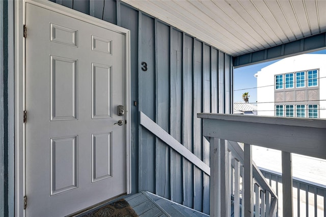 812 Gulf # 3, Indian Rocks Beach, FL 33785 - doorway to property featuring board and batten siding