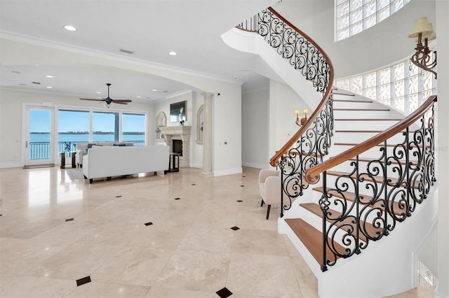 700 126th Ave, Treasure Island, FL 33706 - stairway featuring baseboards, ceiling fan, visible vents, and plenty of natural light