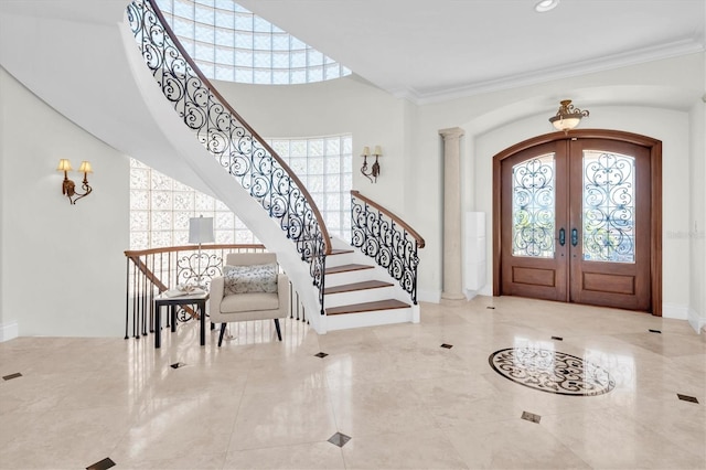 700 126th Ave, Treasure Island, FL 33706 - foyer with crown molding, stairway, french doors, arched walkways, and visible vents