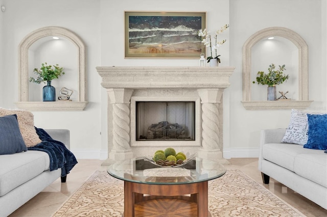700 126th Ave, Treasure Island, FL 33706 - tiled living room with baseboards and a fireplace