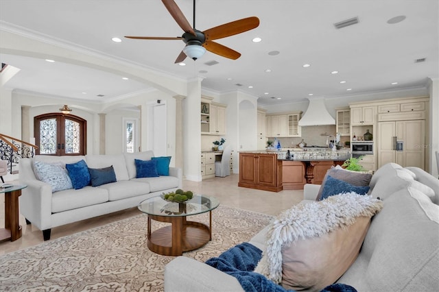 700 126th Ave, Treasure Island, FL 33706 - living area featuring visible vents, ceiling fan, ornamental molding, recessed lighting, and arched walkways