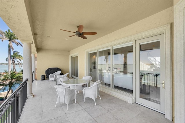 700 126th Ave, Treasure Island, FL 33706 - view of patio with a balcony, a water view, and ceiling fan