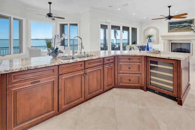 700 126th Ave, Treasure Island, FL 33706 - kitchen with open floor plan, wine cooler, ceiling fan, and a sink