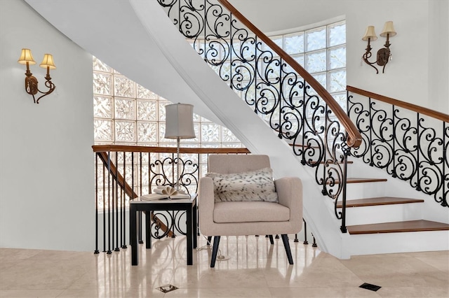 700 126th Ave, Treasure Island, FL 33706 - staircase featuring a wealth of natural light