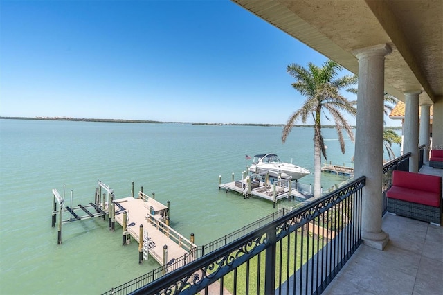 700 126th Ave, Treasure Island, FL 33706 - balcony featuring a water view, boat lift, and a dock