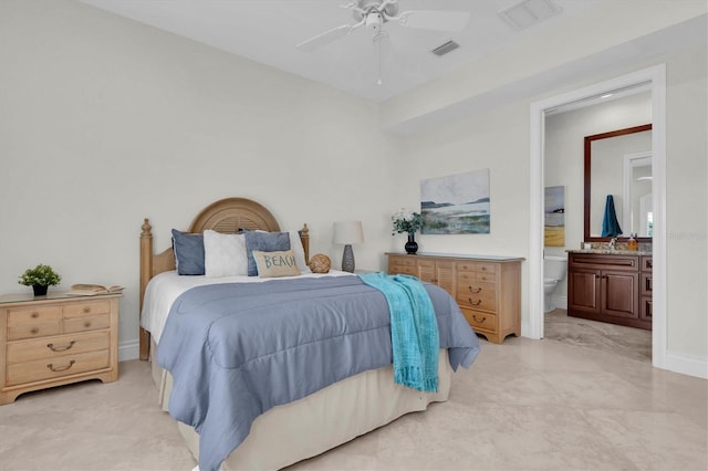 700 126th Ave, Treasure Island, FL 33706 - bedroom featuring ensuite bathroom, baseboards, visible vents, and a ceiling fan
