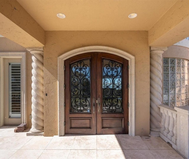 700 126th Ave, Treasure Island, FL 33706 - entrance to property with french doors and stucco siding