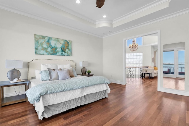 700 126th Ave, Treasure Island, FL 33706 - bedroom with recessed lighting, wood-type flooring, ornamental molding, a raised ceiling, and a notable chandelier