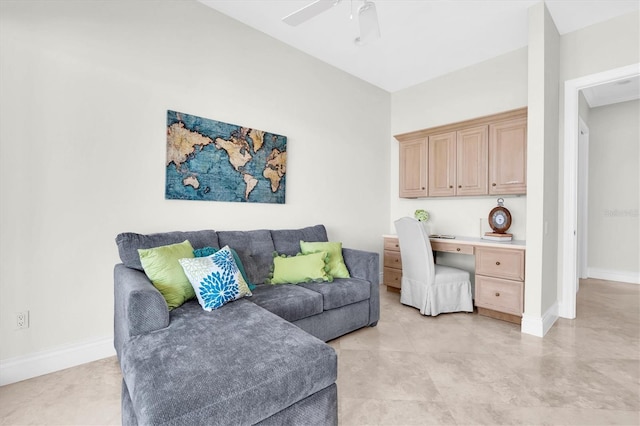 700 126th Ave, Treasure Island, FL 33706 - living area with a ceiling fan, baseboards, and built in desk