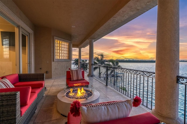 700 126th Ave, Treasure Island, FL 33706 - balcony with a water view and an outdoor living space with a fire pit