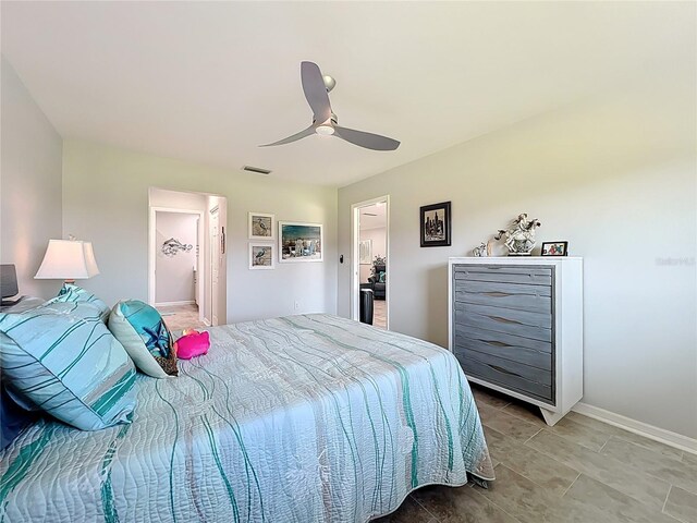 19029 US Highway 19 N Unit 27A, Clearwater, FL 33764 - bedroom with ceiling fan, baseboards, and light tile patterned flooring