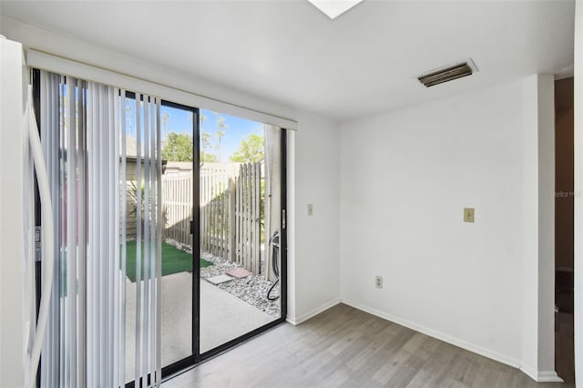 440 Woods Landing Trl, Oldsmar, FL 34677 - interior space featuring wood finished floors, baseboards, and visible vents