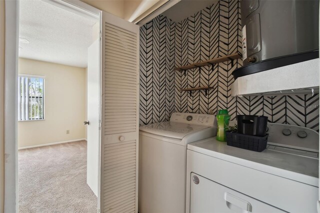 440 Woods Landing Trl, Oldsmar, FL 34677 - laundry area featuring a textured ceiling, carpet, baseboards, laundry area, and washing machine and dryer
