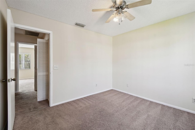 440 Woods Landing Trl, Oldsmar, FL 34677 - carpeted spare room with baseboards, visible vents, ceiling fan, and a textured ceiling