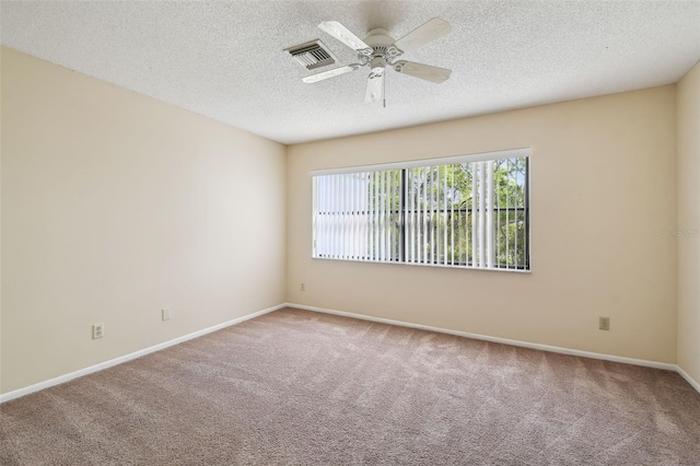 440 Woods Landing Trl, Oldsmar, FL 34677 - carpeted spare room with baseboards, a textured ceiling, visible vents, and a ceiling fan