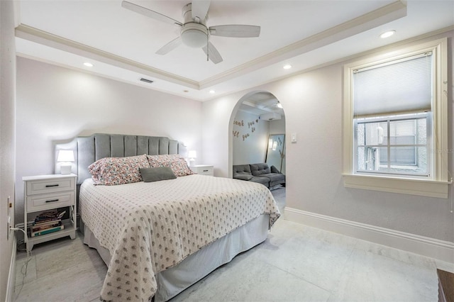 107 S Obrien St Unit 117, Tampa, FL 33609 - bedroom with a tray ceiling, recessed lighting, arched walkways, crown molding, and baseboards