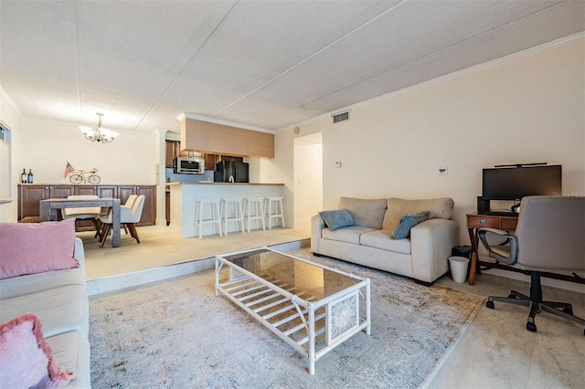 107 S Obrien St Unit 117, Tampa, FL 33609 - living area with an inviting chandelier, crown molding, and visible vents
