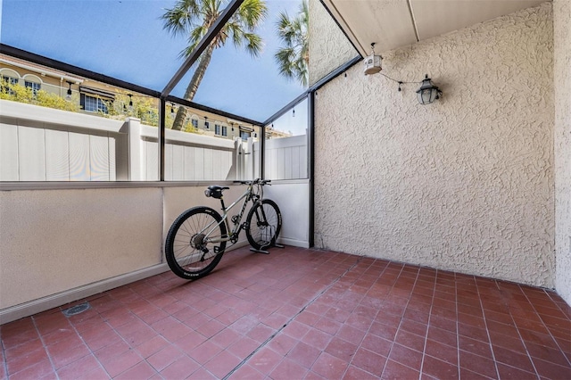 107 S Obrien St Unit 117, Tampa, FL 33609 - view of patio featuring glass enclosure and fence