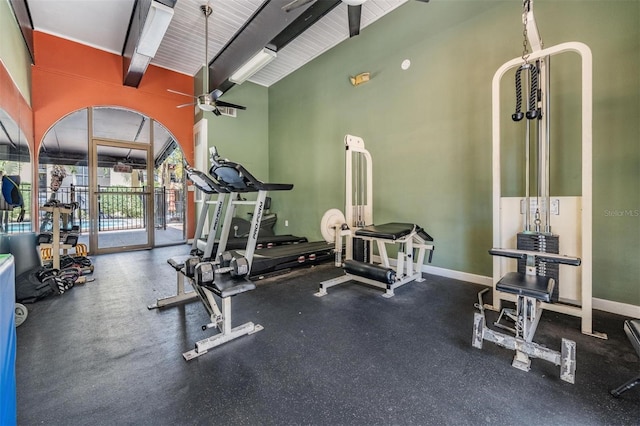 107 S Obrien St Unit 117, Tampa, FL 33609 - workout area featuring baseboards, ceiling fan, and vaulted ceiling