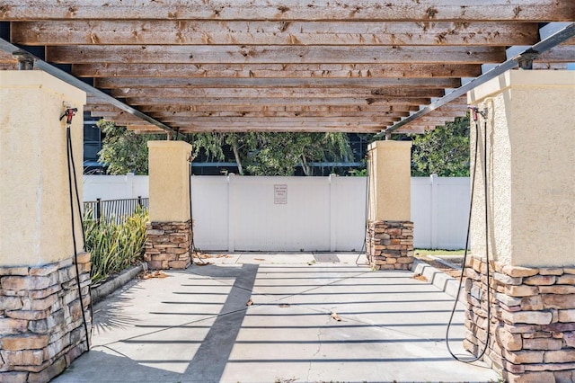 107 S Obrien St Unit 117, Tampa, FL 33609 - view of patio featuring fence and a pergola