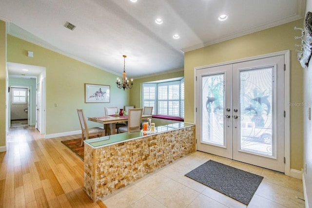 3545 Seaway Dr, New Port Richey, FL 34652 - interior space with visible vents, plenty of natural light, french doors, and ornamental molding