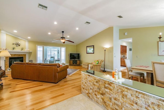 3545 Seaway Dr, New Port Richey, FL 34652 - living area with visible vents, lofted ceiling, and a ceiling fan