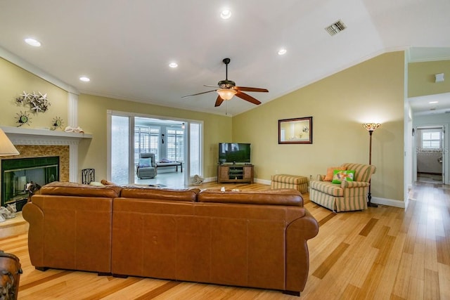 3545 Seaway Dr, New Port Richey, FL 34652 - living room with vaulted ceiling, a ceiling fan, visible vents, and light wood finished floors