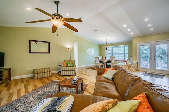3545 Seaway Dr, New Port Richey, FL 34652 - living area with lofted ceiling, ceiling fan with notable chandelier, wood finished floors, crown molding, and baseboards