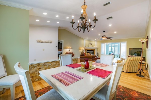 3545 Seaway Dr, New Port Richey, FL 34652 - dining space featuring visible vents, crown molding, and wood finished floors