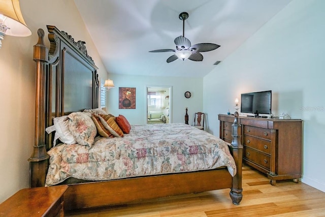 3545 Seaway Dr, New Port Richey, FL 34652 - bedroom featuring baseboards, lofted ceiling, a ceiling fan, and light wood finished floors
