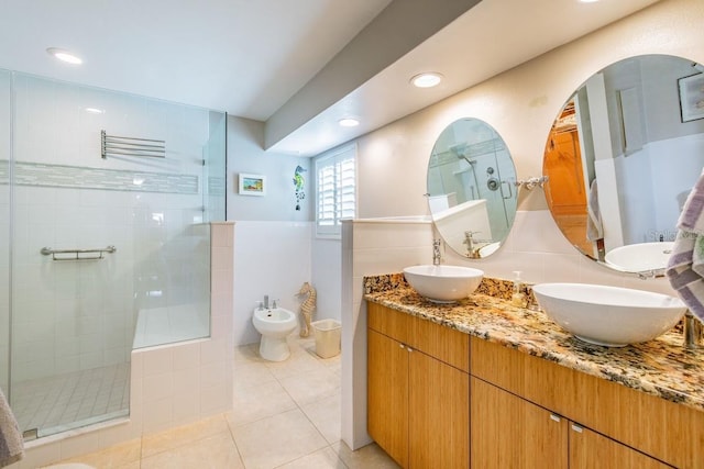 3545 Seaway Dr, New Port Richey, FL 34652 - full bathroom with tile patterned floors, double vanity, a tile shower, and a sink