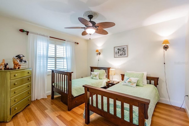 3545 Seaway Dr, New Port Richey, FL 34652 - bedroom featuring light wood-style floors, baseboards, and ceiling fan
