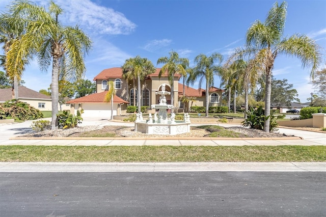 4404 Lake In The Woods Dr, Spring Hill, FL 34607 - mediterranean / spanish home with stucco siding and driveway