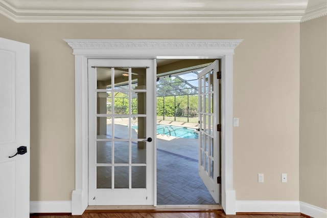 4404 Lake In The Woods Dr, Spring Hill, FL 34607 - doorway with crown molding, baseboards, and french doors